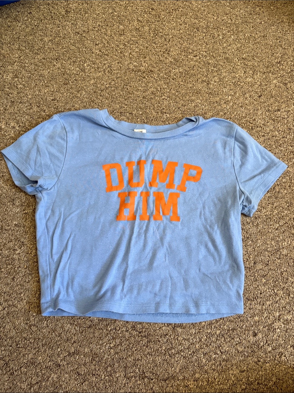 GARAGE Women’s baby tee Light Blue Tee with Orange 'DUMP HIM' Graphic